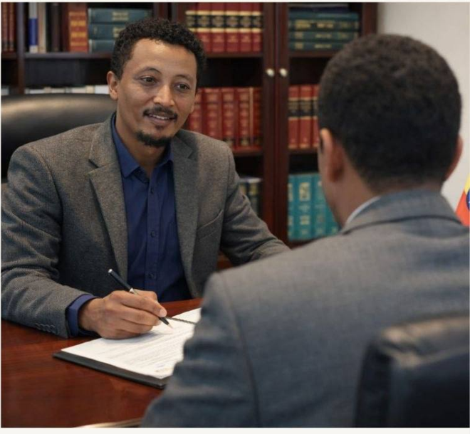 Dr. Solomon Girma Law Office desk with gavel and law books